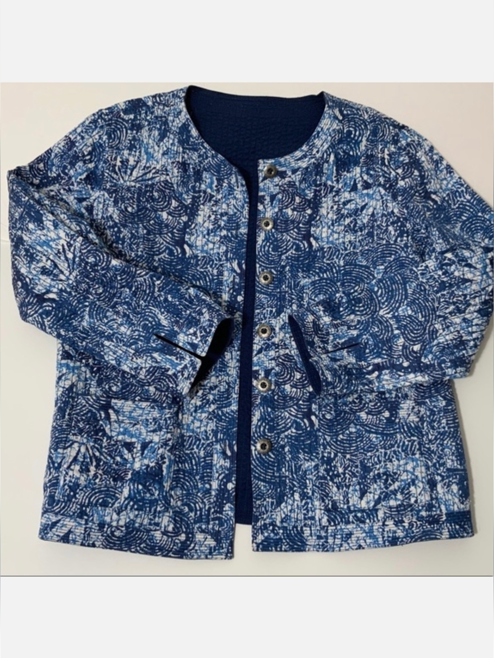 reversible blue and white cotton quilted jacket.